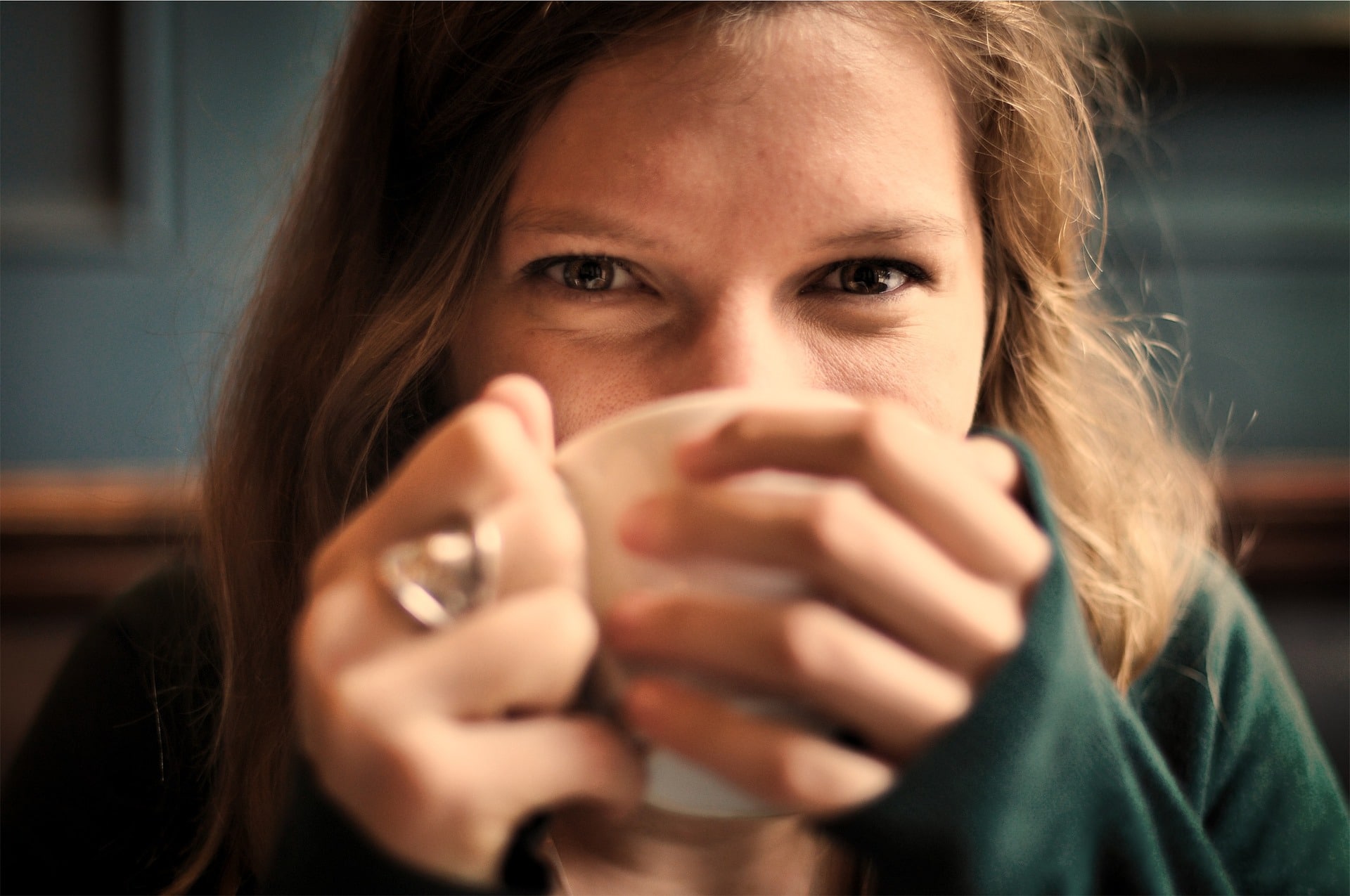 girl drinking tea - staying healthy during cold and flu season