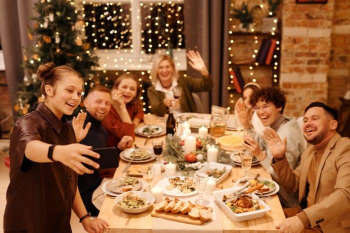 holiday dental tips - family gathered for holiday dinner