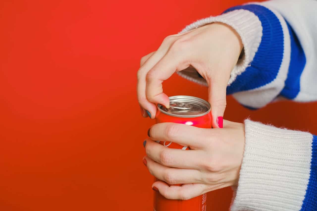 closeup of opening up a soda can