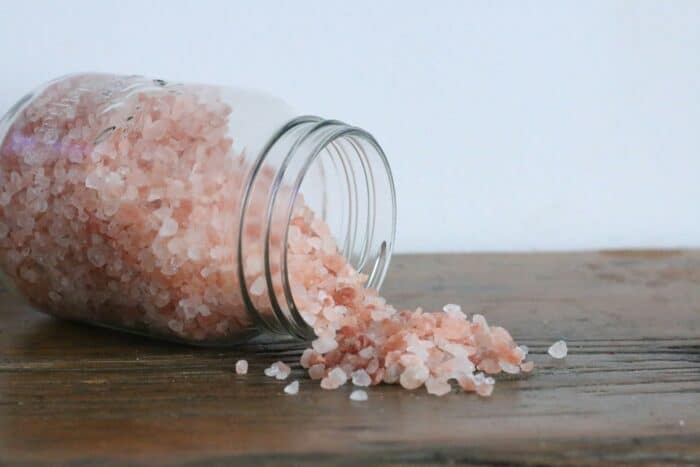 spilled jar of pink Himalayan salt