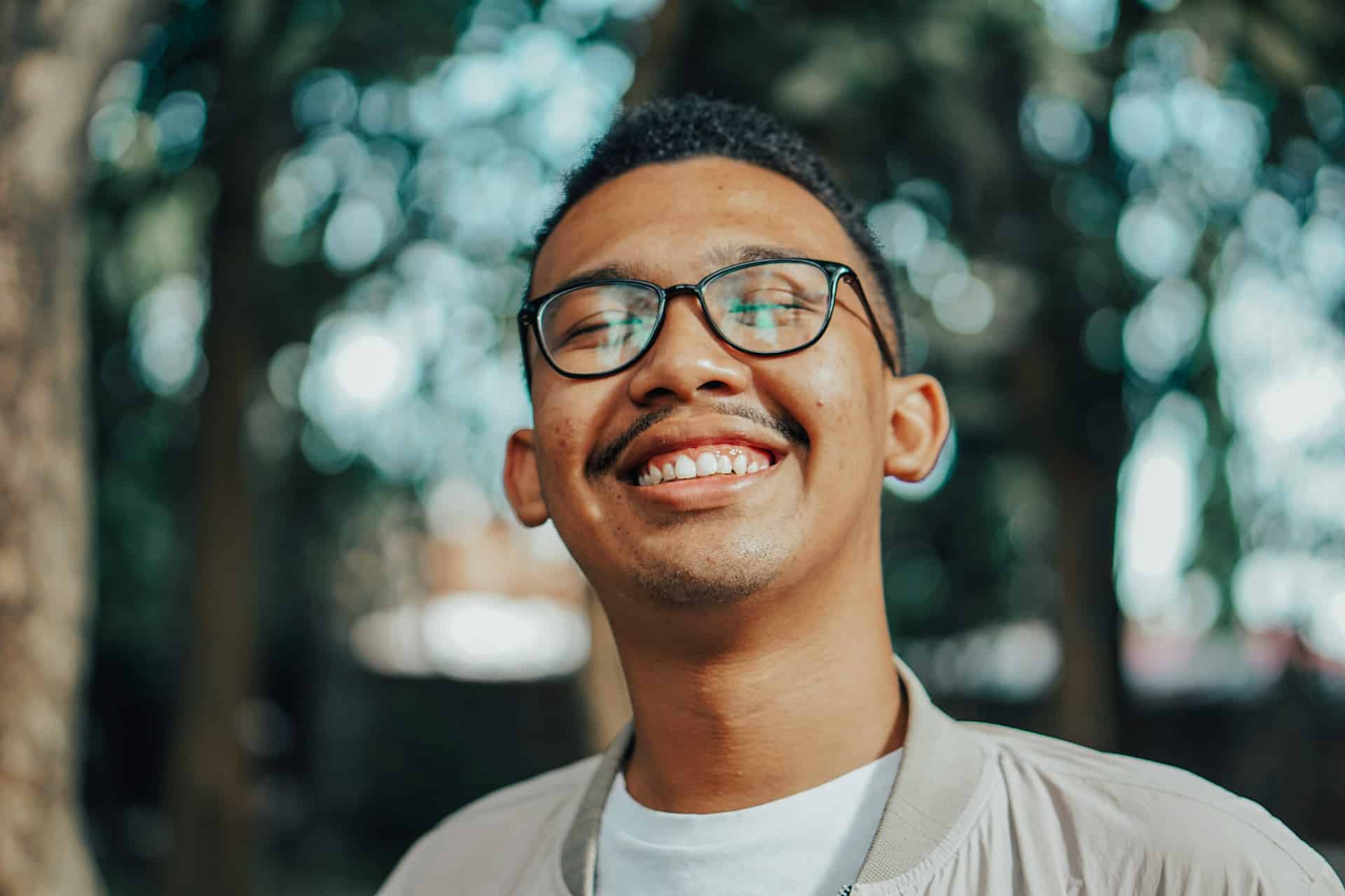 man with glasses smiling