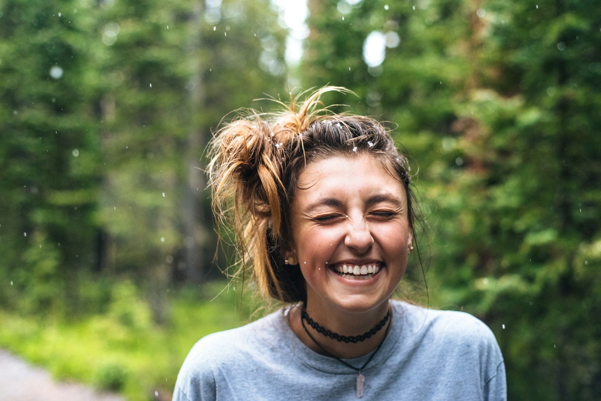 woman smiling in woods